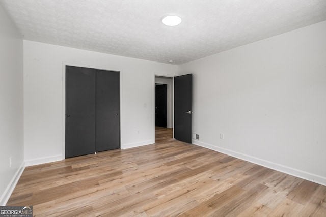 7455 Dover Ct, Riverdale, GA 30274 - unfurnished bedroom with light wood-style flooring and baseboards