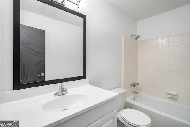 7455 Dover Ct, Riverdale, GA 30274 - full bath featuring toilet, vanity, shower / bath combination, and a textured ceiling
