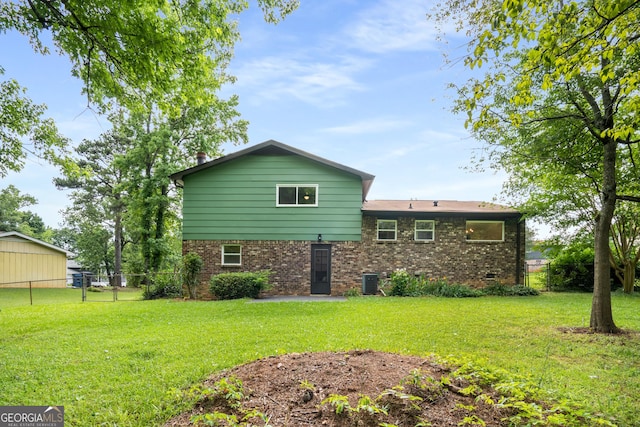 7455 Dover Ct, Riverdale, GA 30274 - rear view of house featuring brick siding and cooling unit
