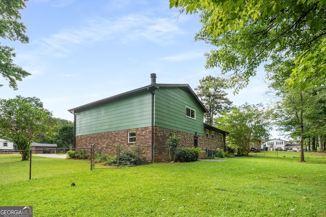 7455 Dover Ct, Riverdale, GA 30274 - view of side of home featuring brick siding and central AC