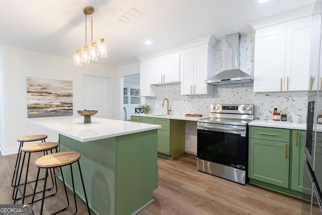 398 Baker Cir NW, Atlanta, GA 30318 - kitchen featuring green cabinets, stainless steel electric stove, wall chimney exhaust hood, and white cabinets