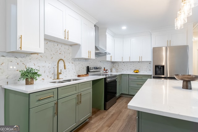 398 Baker Cir NW, Atlanta, GA 30318 - kitchen featuring appliances with stainless steel finishes, green cabinetry, a sink, wall chimney exhaust hood, and recessed lighting