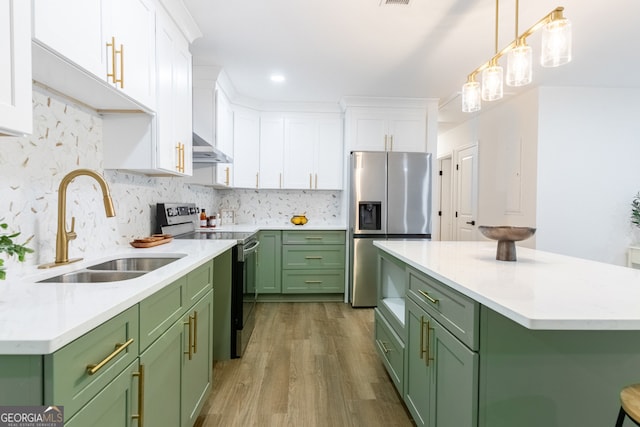 398 Baker Cir NW, Atlanta, GA 30318 - kitchen featuring green cabinetry, stainless steel appliances, a sink, white cabinets, and wood finished floors