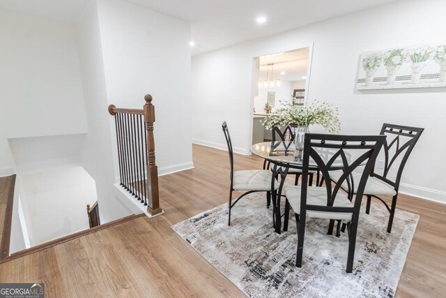 398 Baker Cir NW, Atlanta, GA 30318 - dining area with wood finished floors, recessed lighting, a chandelier, and baseboards