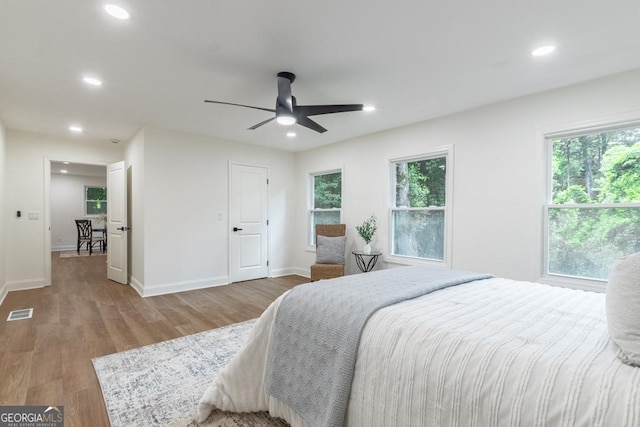 398 Baker Cir NW, Atlanta, GA 30318 - bedroom featuring recessed lighting, wood finished floors, multiple windows, baseboards, and a ceiling fan