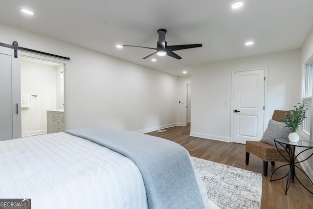 398 Baker Cir NW, Atlanta, GA 30318 - bedroom featuring wood finished floors, a barn door, recessed lighting, baseboards, and ceiling fan