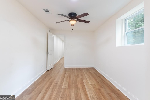 398 Baker Cir NW, Atlanta, GA 30318 - spare room featuring light wood-style floors, ceiling fan, and baseboards