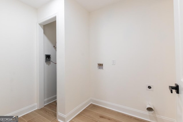 398 Baker Cir NW, Atlanta, GA 30318 - washroom with hookup for an electric dryer, light wood-type flooring, baseboards, and hookup for a washing machine