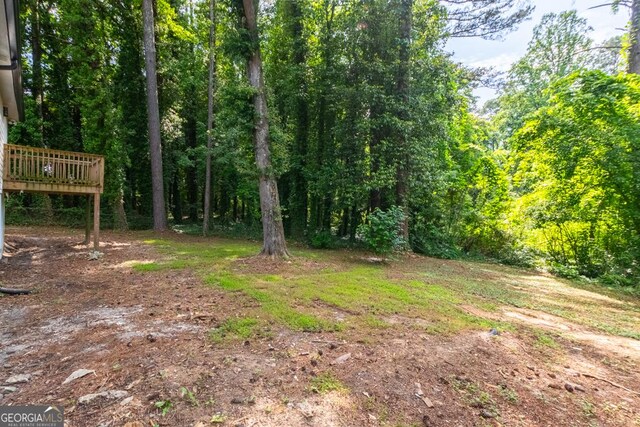 398 Baker Cir NW, Atlanta, GA 30318 - view of yard featuring a wooded view
