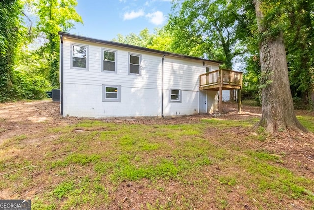 398 Baker Cir NW, Atlanta, GA 30318 - rear view of house with a wooden deck and central AC unit