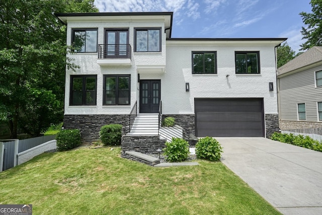2804 Skyland Dr NE, Brookhaven, GA 30341 - contemporary home featuring french doors, a balcony, a garage, concrete driveway, and stone siding