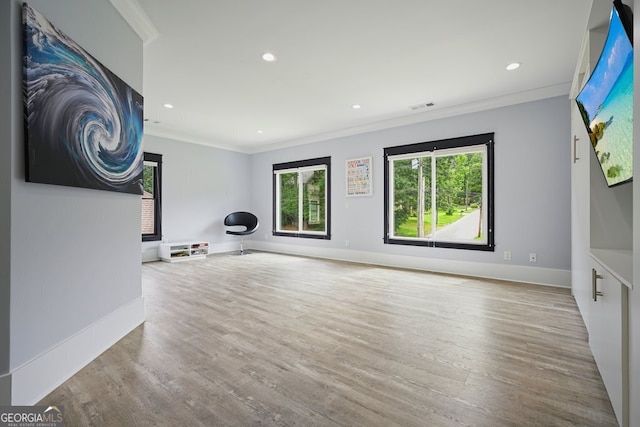 2804 Skyland Dr NE, Brookhaven, GA 30341 - unfurnished living room with crown molding, wood finished floors, baseboards, and recessed lighting