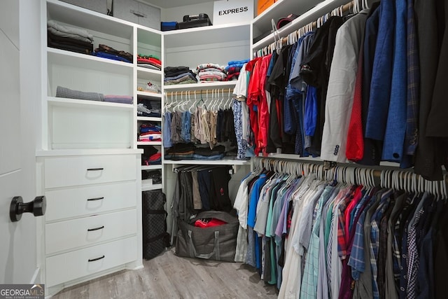 2804 Skyland Dr NE, Brookhaven, GA 30341 - walk in closet featuring wood finished floors