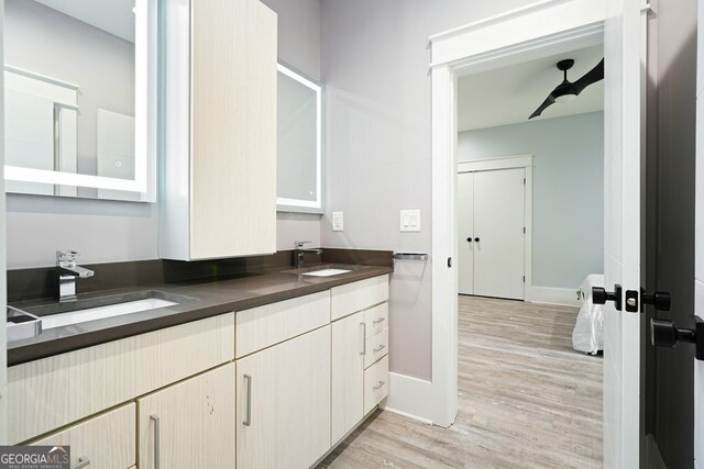 2804 Skyland Dr NE, Brookhaven, GA 30341 - bathroom with double vanity, wood finished floors, and baseboards