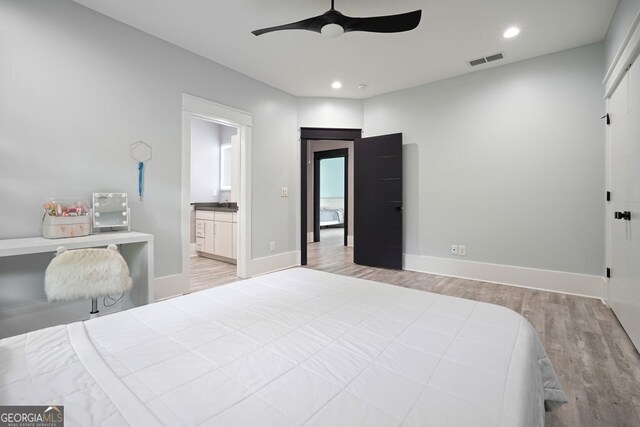 2804 Skyland Dr NE, Brookhaven, GA 30341 - bedroom featuring wood finished floors, recessed lighting, baseboards, ensuite bathroom, and a ceiling fan