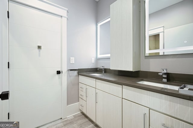2804 Skyland Dr NE, Brookhaven, GA 30341 - bathroom featuring double vanity and wood finished floors