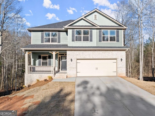554 Creek Rd, Cornelia, GA 30531 - craftsman-style house featuring a porch, brick siding, concrete driveway, and an attached garage