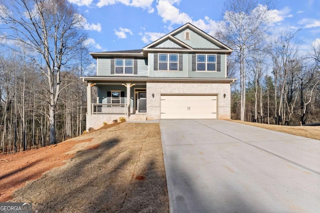 554 Creek Rd, Cornelia, GA 30531 - craftsman-style house featuring covered porch, concrete driveway, a garage, and brick siding