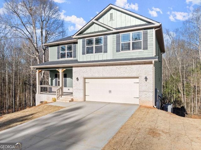 554 Creek Rd, Cornelia, GA 30531 - view of front of property featuring covered porch, brick siding, an attached garage, and driveway