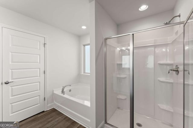 554 Creek Rd, Cornelia, GA 30531 - full bathroom featuring a stall shower, a bath, wood finished floors, recessed lighting, and baseboards