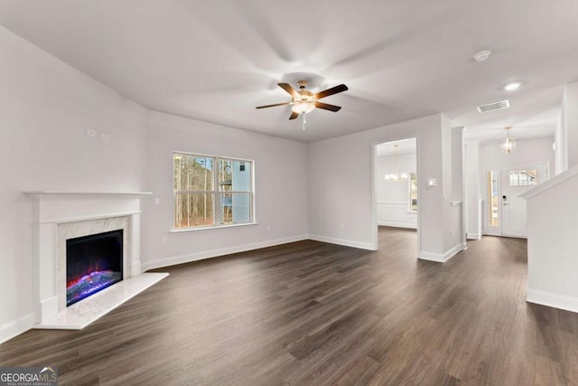 325 Magnolia Villas Dr, Cornelia, GA 30531 - unfurnished living room with plenty of natural light, a ceiling fan, a premium fireplace, and baseboards