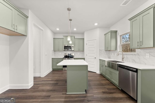 325 Magnolia Villas Dr, Cornelia, GA 30531 - kitchen featuring stainless steel appliances, green cabinetry, a sink, decorative backsplash, and recessed lighting