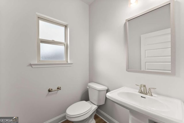 325 Magnolia Villas Dr, Cornelia, GA 30531 - bathroom featuring toilet, baseboards, a sink, and wood finished floors