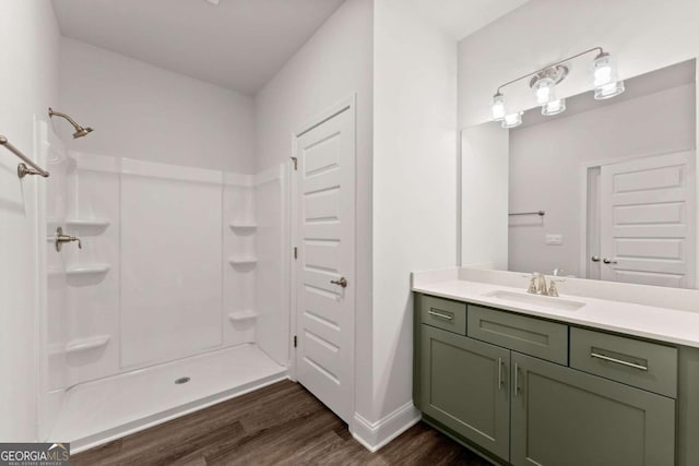 325 Magnolia Villas Dr, Cornelia, GA 30531 - bathroom with vanity, wood finished floors, a shower, and baseboards