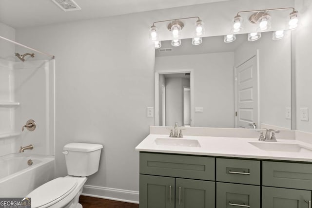 325 Magnolia Villas Dr, Cornelia, GA 30531 - bathroom featuring toilet, double vanity, bathing tub / shower combination, baseboards, and wood finished floors