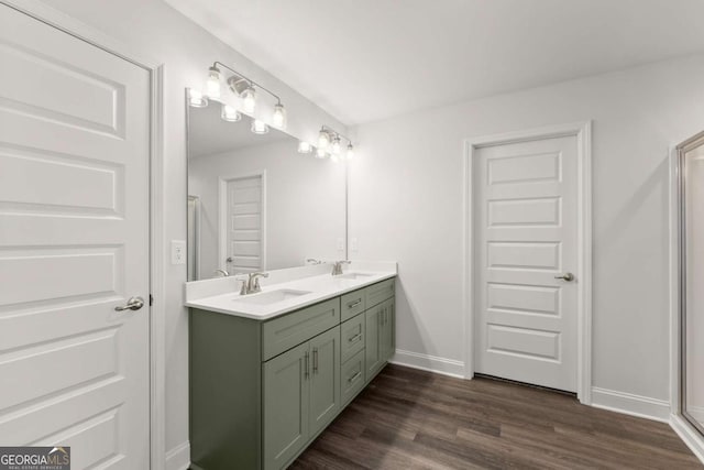 325 Magnolia Villas Dr, Cornelia, GA 30531 - bathroom with double vanity, wood finished floors, and baseboards