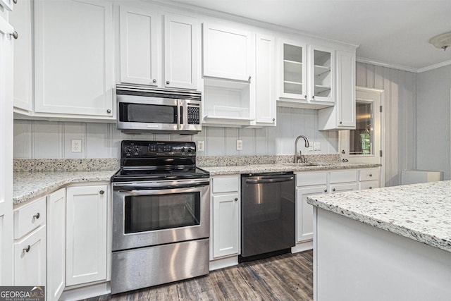 2701 Log Cabin Dr SE, Atlanta, GA 30339 - kitchen featuring appliances with stainless steel finishes, dark wood-style flooring, white cabinets, crown molding, and a sink
