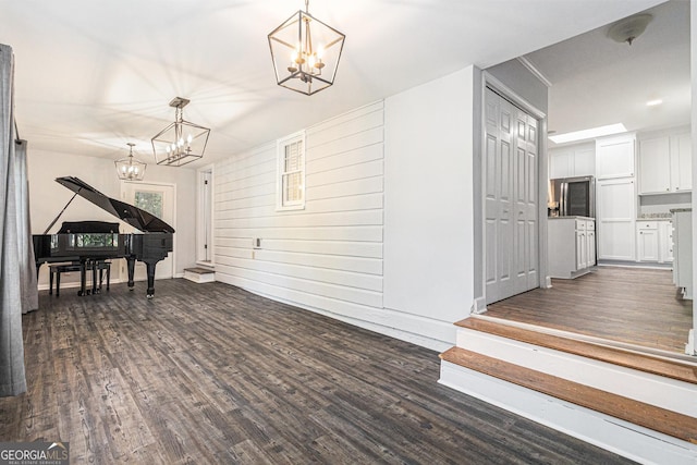2701 Log Cabin Dr SE, Atlanta, GA 30339 - interior space featuring a chandelier, dark wood-style flooring, and baseboards