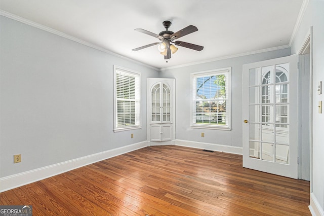 2701 Log Cabin Dr SE, Atlanta, GA 30339 - unfurnished room featuring hardwood / wood-style flooring, ceiling fan, crown molding, and baseboards