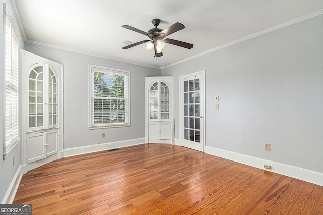 2701 Log Cabin Dr SE, Atlanta, GA 30339 - unfurnished room with hardwood / wood-style flooring, a ceiling fan, baseboards, and ornamental molding