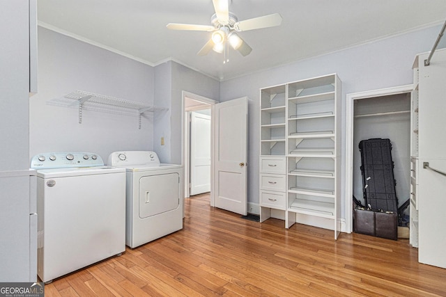 2701 Log Cabin Dr SE, Atlanta, GA 30339 - laundry room featuring washing machine and clothes dryer, ceiling fan, light wood-type flooring, and ornamental molding