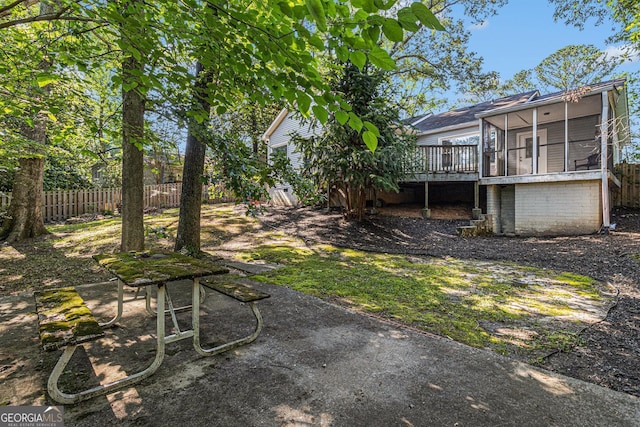 2701 Log Cabin Dr SE, Atlanta, GA 30339 - view of yard with a sunroom and a wooden deck