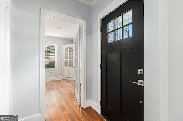 2701 Log Cabin Dr SE, Atlanta, GA 30339 - entrance foyer with ornamental molding, baseboards, wood-type flooring, and plenty of natural light