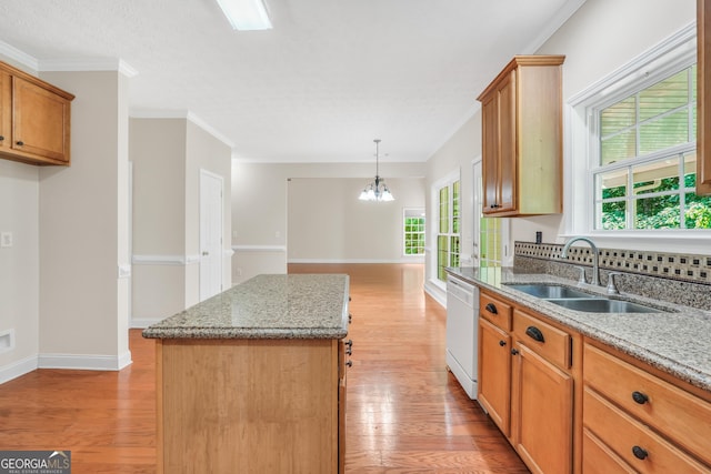 1315 Crane Ct, Mcdonough, GA 30252 - kitchen with dishwasher, a sink, light wood finished floors, a chandelier, and a kitchen island