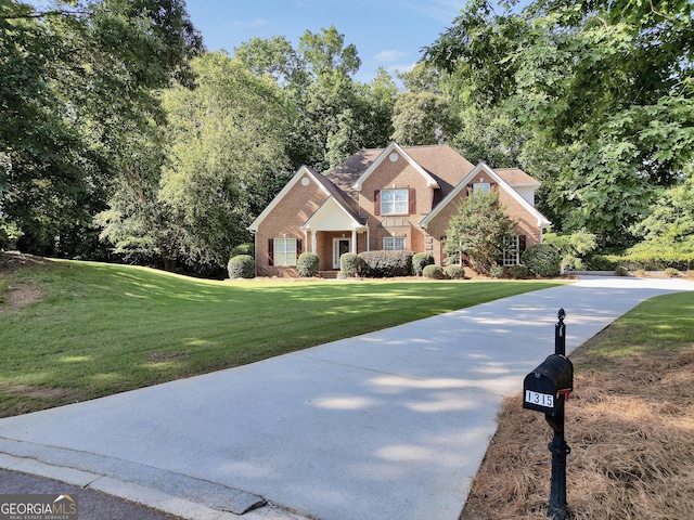 1315 Crane Ct, Mcdonough, GA 30252 - view of front facade featuring brick siding and a front yard