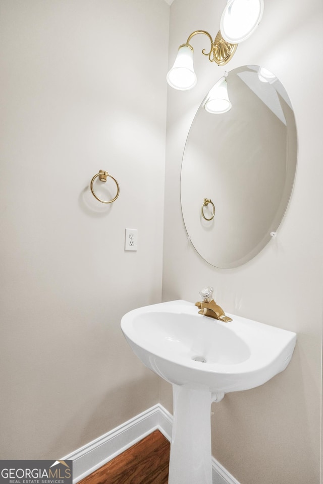 1315 Crane Ct, Mcdonough, GA 30252 - bathroom featuring baseboards and a sink