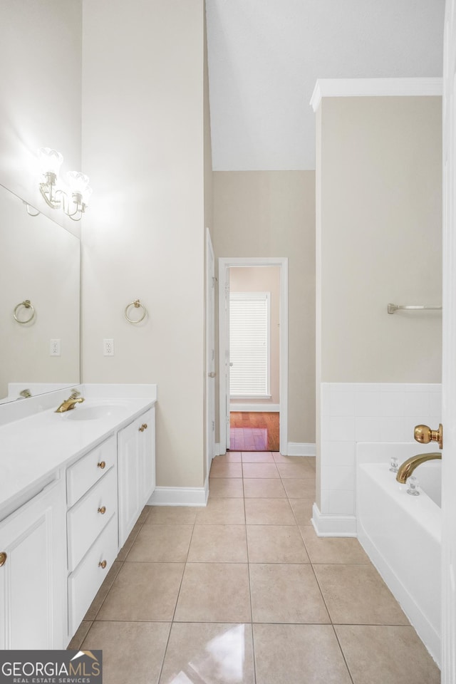 1315 Crane Ct, Mcdonough, GA 30252 - bathroom featuring vanity, a bath, tile patterned flooring, and baseboards