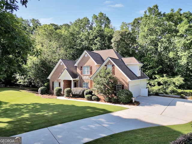 1315 Crane Ct, Mcdonough, GA 30252 - traditional home with brick siding, driveway, an attached garage, a front yard, and a shingled roof