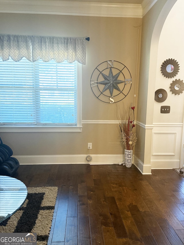 1869 Schofield Dr, Hampton, GA 30228 - entrance foyer featuring arched walkways, hardwood / wood-style flooring, crown molding, and baseboards