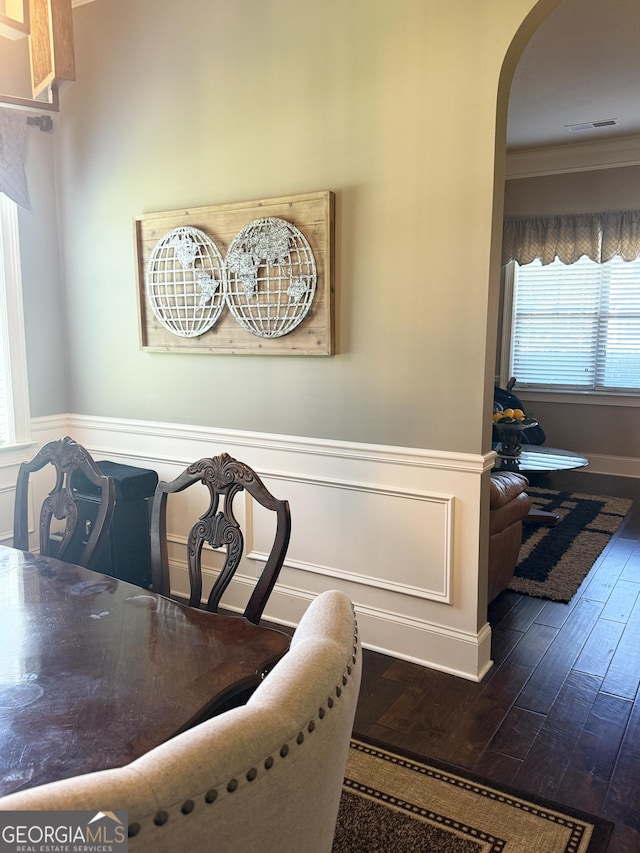 1869 Schofield Dr, Hampton, GA 30228 - dining room with arched walkways, dark wood-type flooring, and crown molding