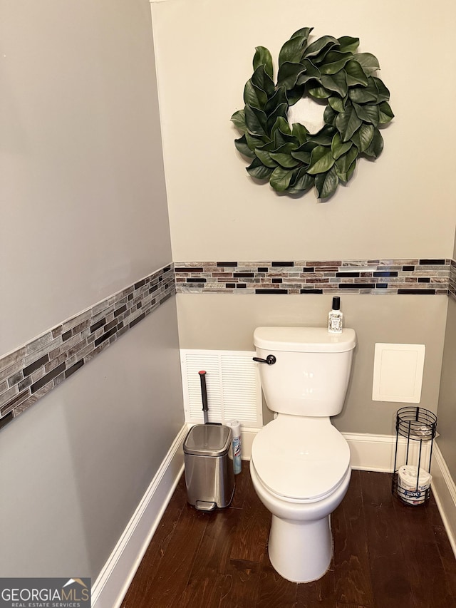 1869 Schofield Dr, Hampton, GA 30228 - half bath featuring toilet and wood finished floors