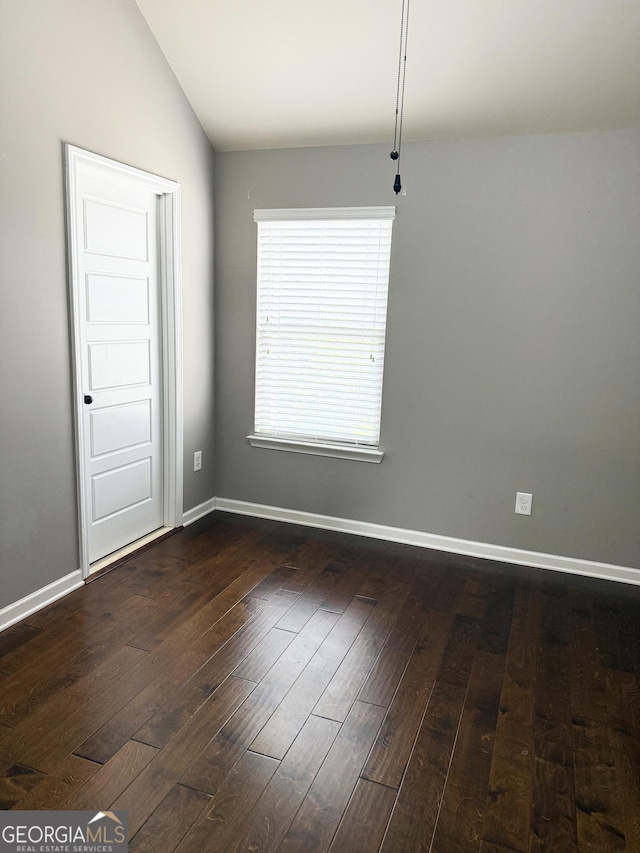 1869 Schofield Dr, Hampton, GA 30228 - unfurnished room with dark wood finished floors and vaulted ceiling