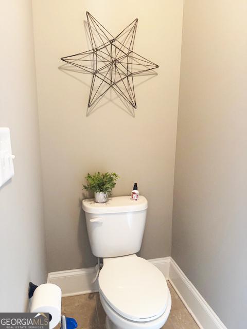 1869 Schofield Dr, Hampton, GA 30228 - bathroom featuring toilet and baseboards