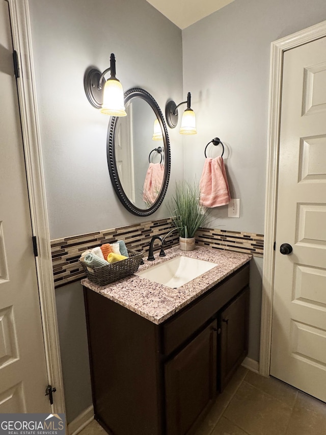 1869 Schofield Dr, Hampton, GA 30228 - bathroom with vanity, backsplash, and tile patterned floors