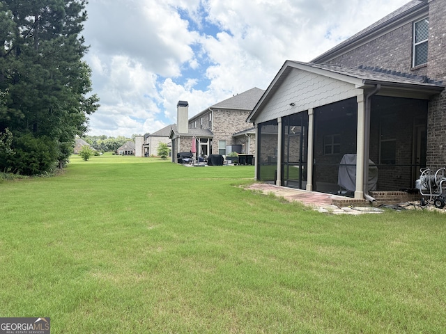 1869 Schofield Dr, Hampton, GA 30228 - view of grassy yard featuring a sunroom