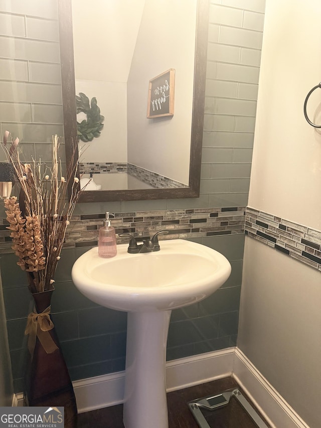1869 Schofield Dr, Hampton, GA 30228 - bathroom with tile walls, tasteful backsplash, and a sink